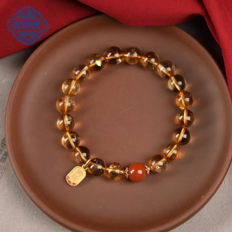 Natural citrine bracelet with red beads belonging to the earth element